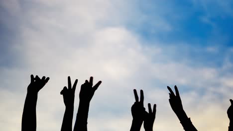 hands reaching for the sky