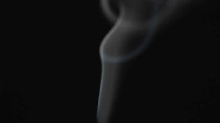 Video of close up of matches with smoke and copy space on black background