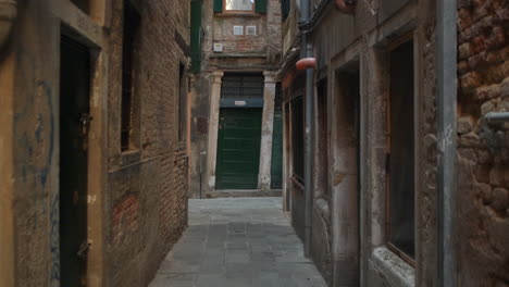 slow steady pov walk in narrow alley surrounded by old historic buildings during daytime