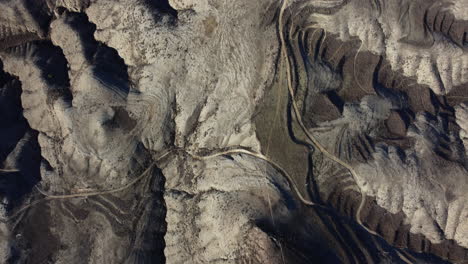 aerial view of a desert landscape with winding roads