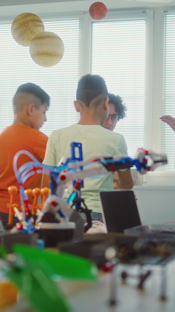 Students learning about science and robotics in a classroom setting