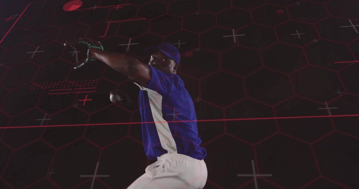 Male pitcher starting windup delivering pitch, rotating torso releasing baseball over sports grid