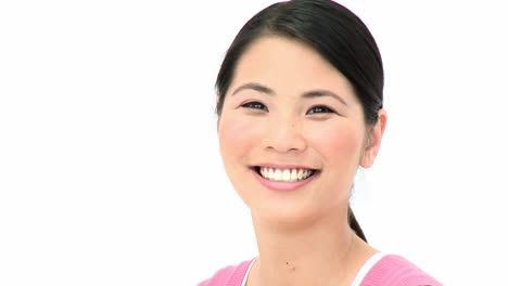 asian woman turning to smile at the camera