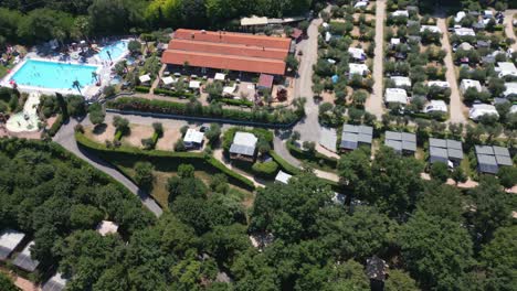 aerial shot of swimming pool at weekend glamping resort near lake garda, italy