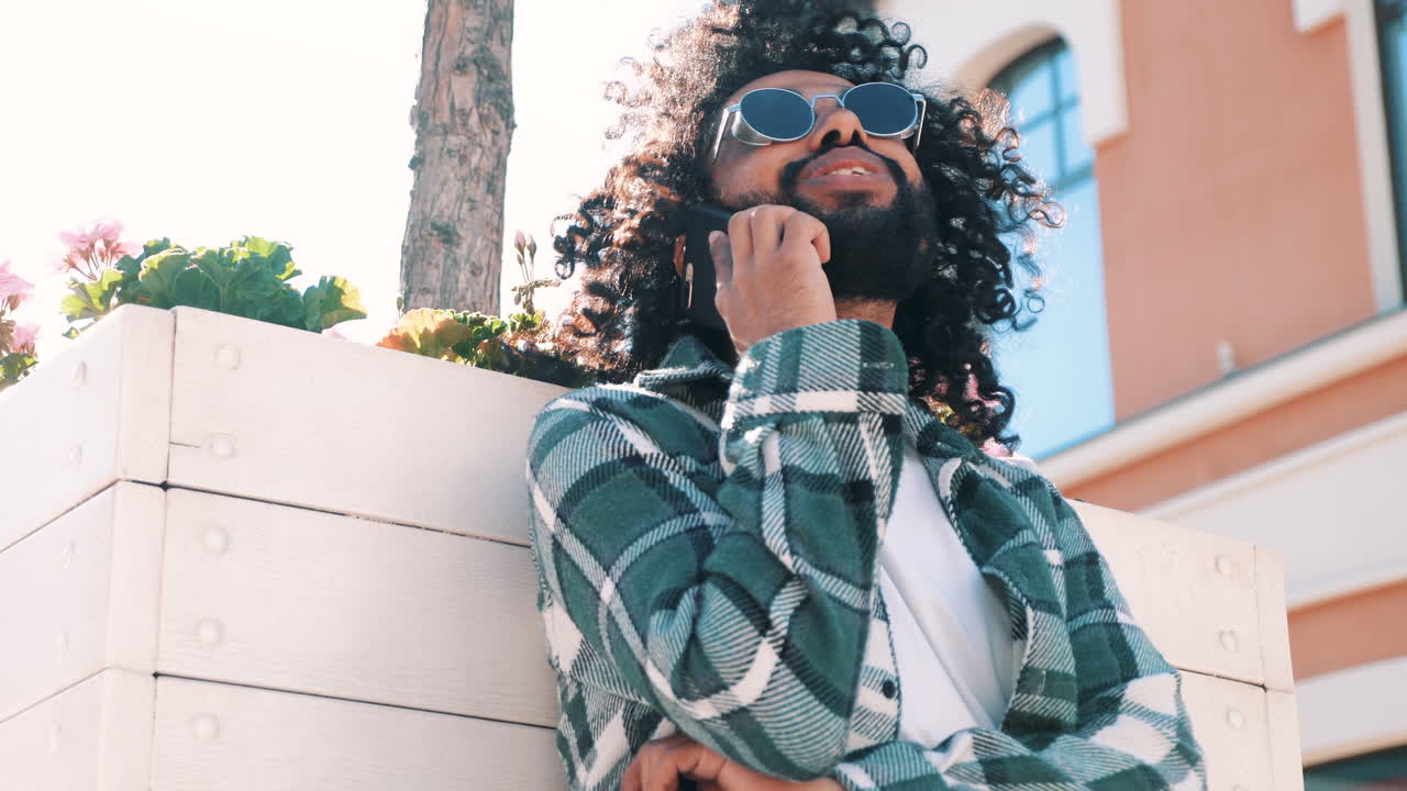 Man Talking on Phone Outdoors