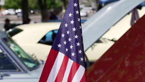 american flag on the vintage car during car show