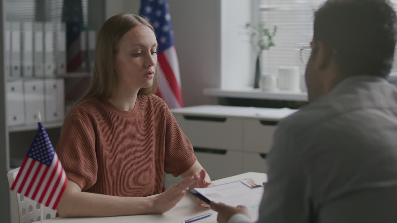 Woman Being Interviewed by US Consular Officer during Visa Appointment