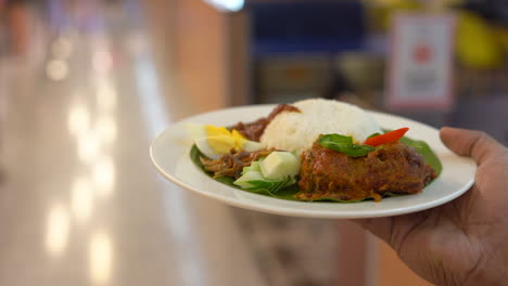 One-man-woke-with-a-rice-plate-holding-on-hand