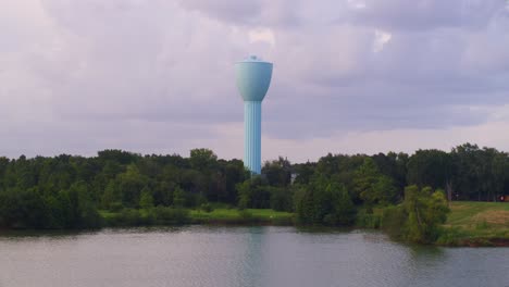 4k drone shot of brays bayou and iconic blue water tower in alief, texas