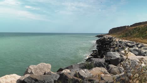 Static-shot-of-a-rocky-sea-coastline-and-turquoise-water