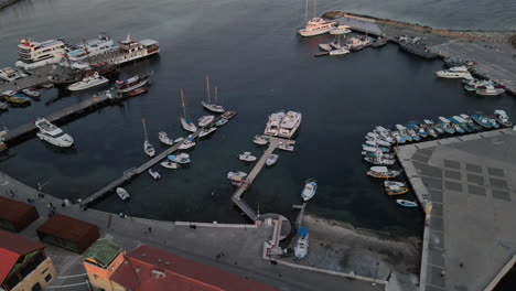 aerial over captivating beauty of pafos' harbour at sunset, cyprus