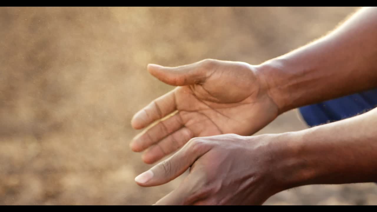 Hands Dusting Off Dirt