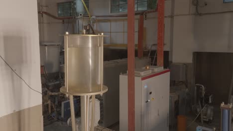 closeup view of a plastic stirrer used for mixing solutions. pvc pipe making factory in karachi, pakistan.