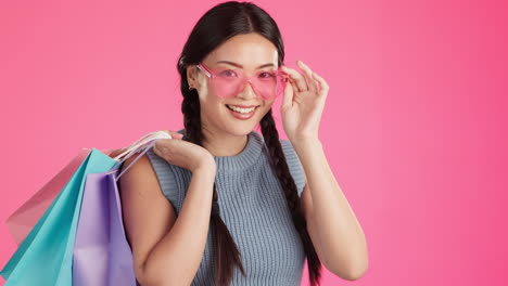 Shopping,-studio-and-Asian-woman-portrait-feeling