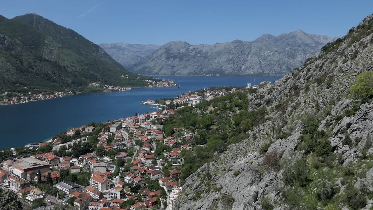 Kotor Bay and Town by the sea and mountains, cinematic reveal shot, Montenegro