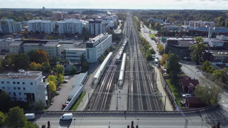 aerial view: train leaves kerava, finland heading south to helsinki