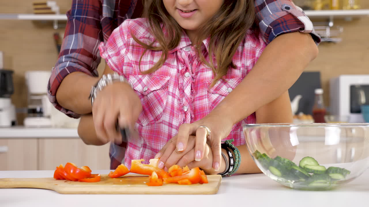Father and Daughter Preparing Healthy Salad Together