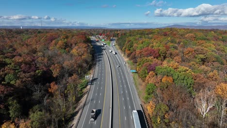 highway in usa surrounded by colorful fall foliage in appalachia during autumn