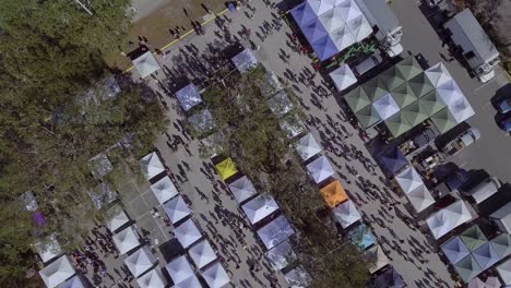 4k aerial drone video of farmers market at parking lot of waterfront soccer stadium in st