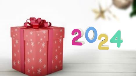 animación de texto de 2024 y regalos de navidad y decoraciones en el fondo.
