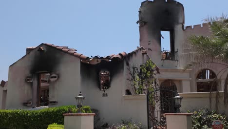 gimbal close-up panning shot of the charred ruins of a home burned by the eaton fire in altadena, california. 4k
