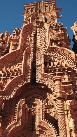 close-up of intricately carved stonework on a mayan temple