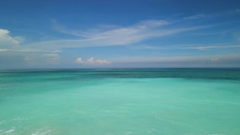 men on the beautiful white sand beach, indonesia