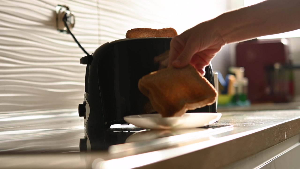Preparing Toast for Breakfast in Modern Kitchen