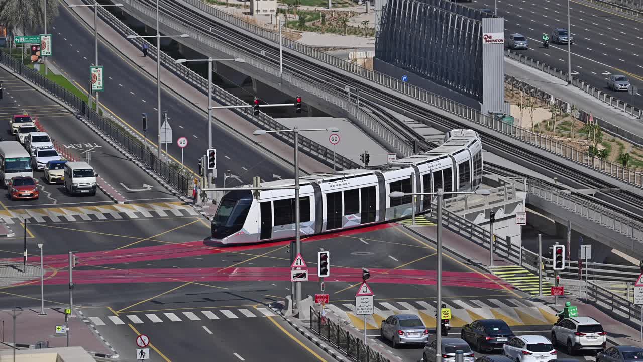 A Dubai Tram travels through the Marina area, on Sheikh Zayed Road in Dubai, UAE