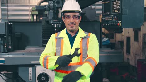 young factory worker or engineer close up portrait in factory