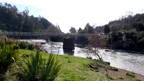 bridge over ohinemuri river on karangahake gorge in rural countryside of north island in new zealand aotearoa