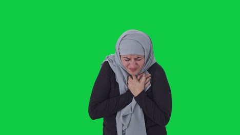 sick muslim woman having a heart attack green screen