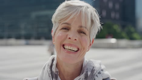 portrait-beautiful-senior-caucasian-woman-laughing-enjoying-successful-urban-lifestyle-in-city