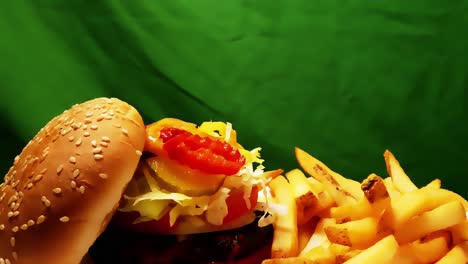 Combo-De-Hamburguesa-Papas-Fritas-Closeup-Revelan-Girando-En-Un-Plato-Ovalado-Blanco-A-360-Grados-Con-Pieles-En-Tiras-De-Papas-Hamburguesa-De-Carne-Molida-A-La-Parrilla-En-Panecillo-Kaiser-Con-Guarniciones-Apiladas-Cromakey-En-Bucle-2-2