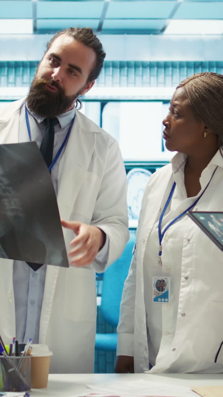 Vertical Video Doctors team working in a medical treatment center to find diagnosis
