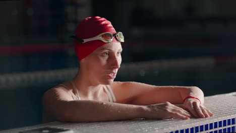 woman swimmer preparing for a competition in a pool