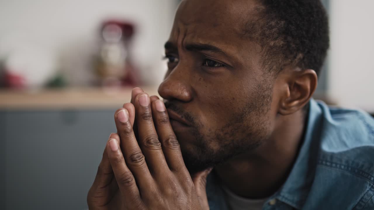 Extreme close up video of man watching TV
