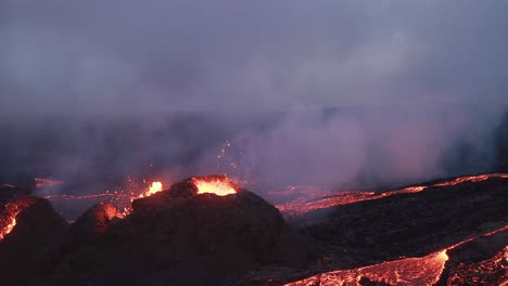 glowing red river of molten rock flowing from the geldingadalur volcanoes in iceland -aerial