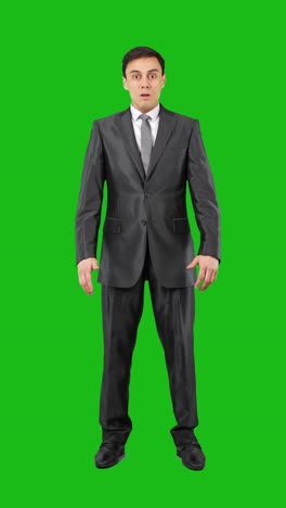 businessman on green screen: serious and surprised expressions