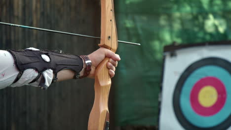 firing a archery hunting practice bow on target