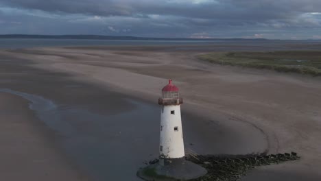 aerial point of interest fly around of old abandoned lighthouse in north wales