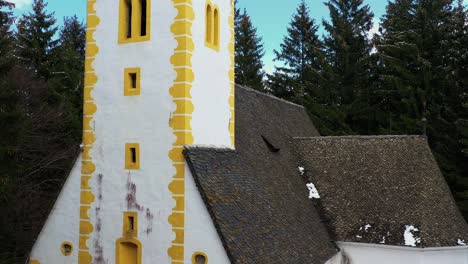 exterior of medieval church in a forest, crane, gib shot