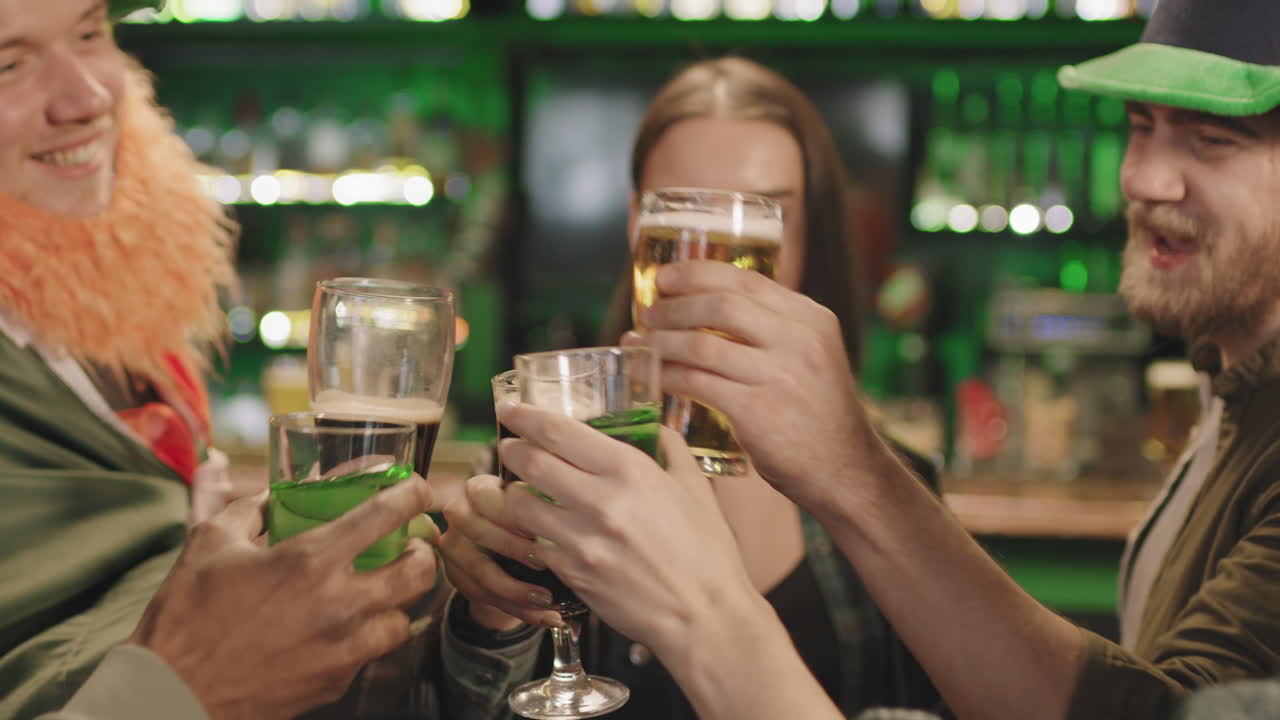 Friends Toasting Glasses Of Beer In Bar
