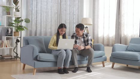 father and daughter studying together at home