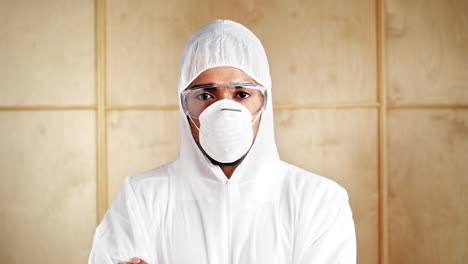 professional cleaner scientist exterminator wearing white dust suit