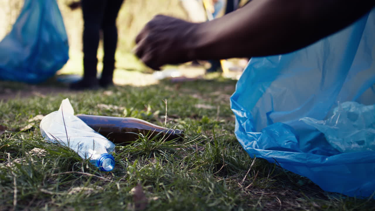 People supporting cleanup of the natural environment by grabbing recyclables