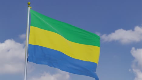 Flag-Of-Gabon-Moving-In-The-Wind-With-A-Clear-Blue-Sky-In-The-Background,-Clouds-Slowly-Moving,-Flagpole,-Slow-Motion