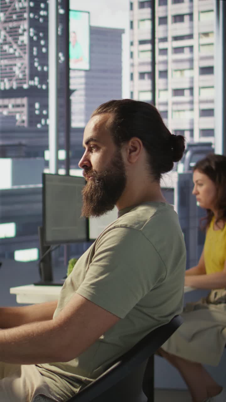 Vertical video IT expert in office focused on transforming data into predictive models