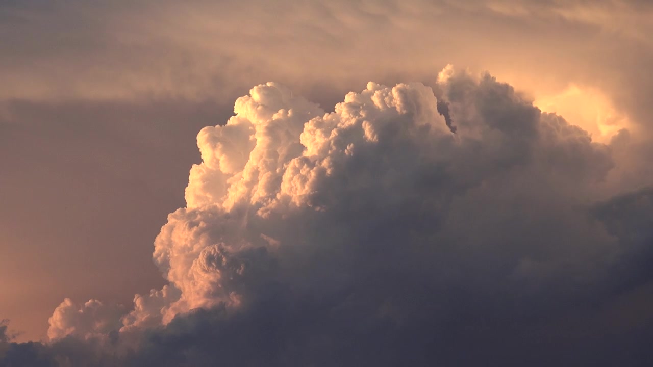 Golden Hour Sunlight Illuminating Large Cumulus Clouds
