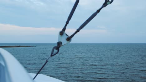 slowly moving footage of gentle waves viewed from a ferry upper deck in 4k